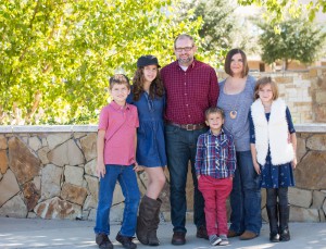 Justin Smith, with his wife, Holly & their children Abraham (10), Sadie (11), Boaz (5), and Hope (8).
